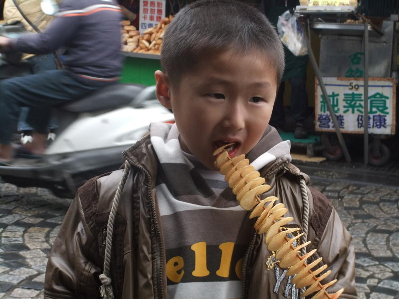 Some Kid eating Potato Chips