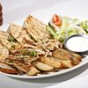 Pitta bread and grilled chicken with yogurt sauce.