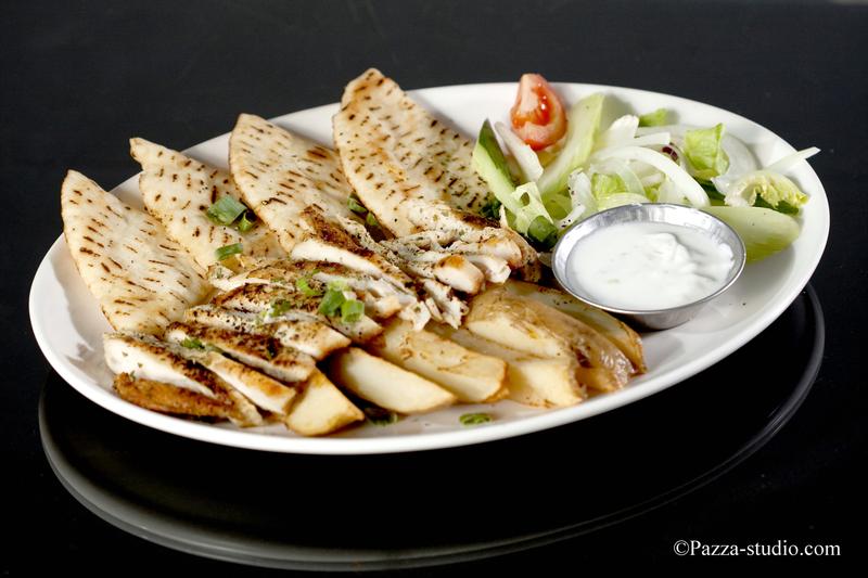  Pitta bread and grilled chicken with yogurt sauce.